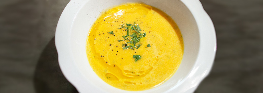 Carrot cream soup with ginger and apricot seed oil